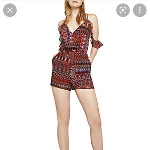 BCBG GENERATION cold shoulder tapestry printed romper. Size S. In rusty coral.